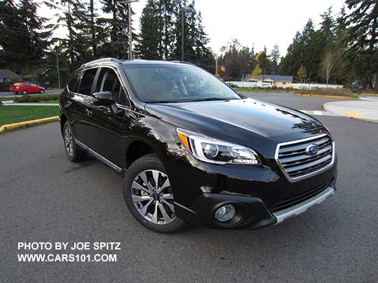 front view Crystal Black 2017 Subaru Outback Touring,  with chrome lower trim strip, silver low profile roof rails