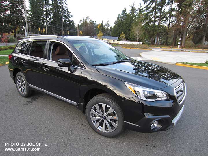 Crystal Black 2017 Subaru Outback Touring with chrome rocker panel trim strip, silver low profile roof rails