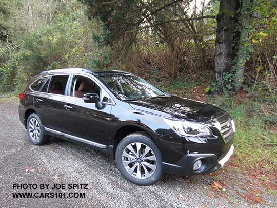 Crystal Black 2017 Subaru Outback Touring with chrome rocker panel trim strip, silver low profile roof rails