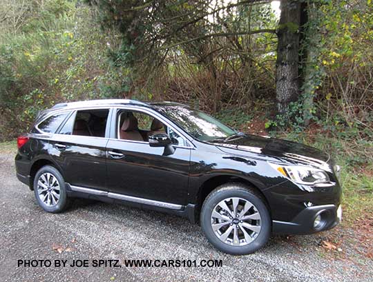 Crystal Black 2017 Subaru Outback Touring with chrome rocker panel trim strip, silver low profile roof rails