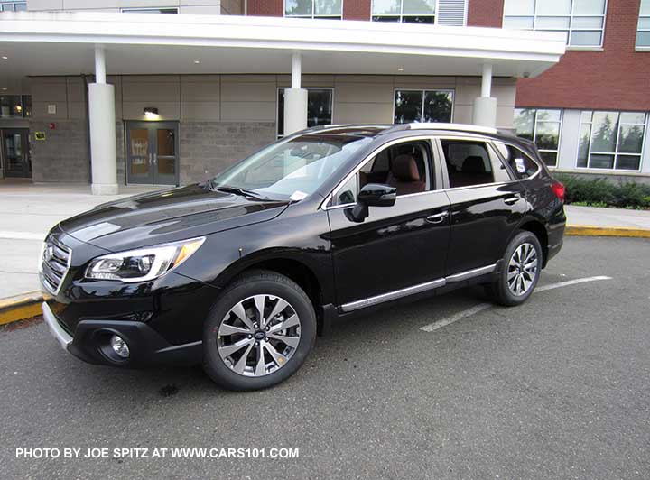 Crystal Black 2017 Subaru Outback Touring with chrome rocker panel trim strip, silver low profile roof rails