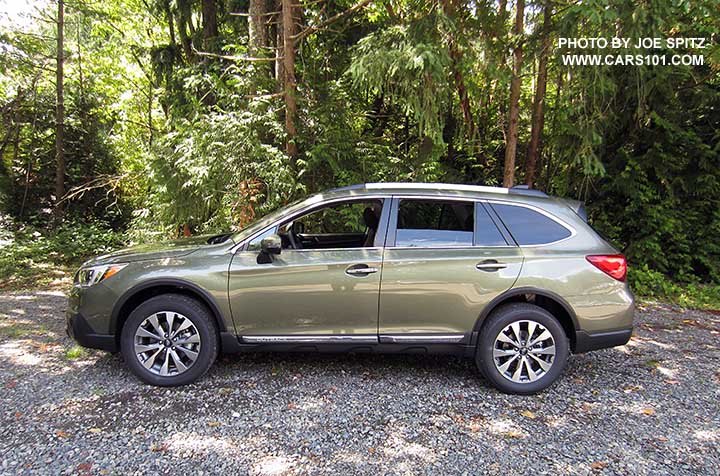 2017 Subaru Outback Touring. Wilderness green shown. Low profile roof rails, chrome trim...