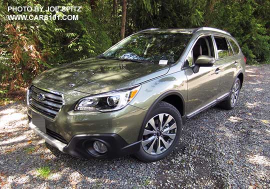 2017 Subaru Outback Touring. Wilderness green shown. Low profile roof rails, chrome trim, gray front grill, machined silver/gray 18" alloys, Optional wheel arch moldimgs.