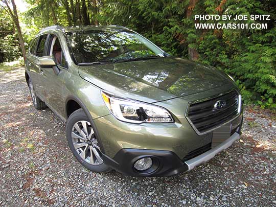 2017 Subaru Outback Touring. Wilderness green shown. Low profile roof rails, chrome trim, 18" silver and gray alloys, front underspoiler, gray front grill