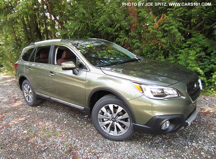 2017 Subaru Outback Touring. Wilderness green shown. Low profile roof rails, chrome trim, 18" silver/gray alloys, shown with wheel arch and side moldings