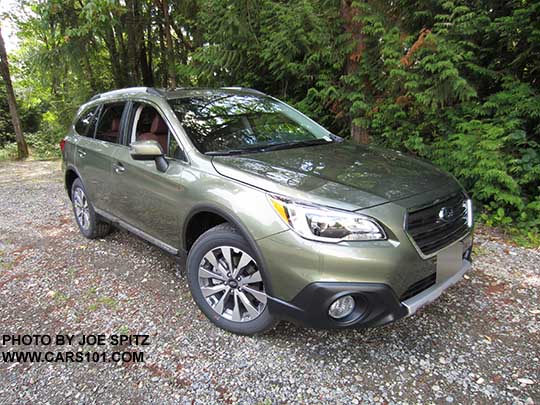 2017 Subaru Outback Touring. Wilderness green shown. Low profile roof rails, chrome trim, 18" silver and gray alloys, shown with wheel arch moldings