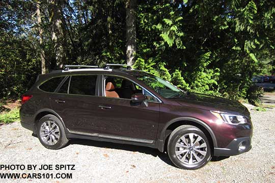 2017 Outback Touring brilliant brown color. Standard rocker panel chrome strip, silver low profile roof rails, silver and gray alloy wheels, Optional Thule crossbars, wheel arch moldings