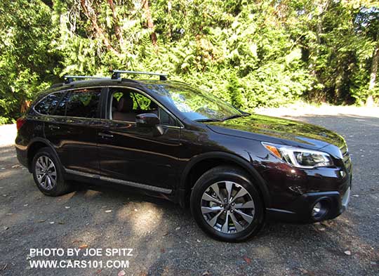 2017 Outback Touring brilliant brown color shines in the sun. Standard rocker panel chrome strip, silver low profile roof rails, silver and gray alloy wheel