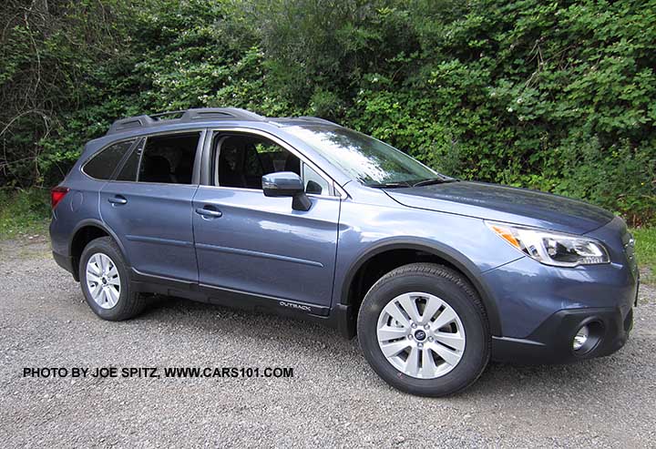 2017 Subaru Outback Premium with option side and wheel arch moldings, and rear bumper cover. Twilight blue color shown. 2.5i and Premium have silver 17" alloy wheels..