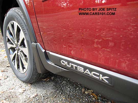 2017 Subaru Outback black rocker panel trim with Outback logo. Limited model shown with optional splash guards