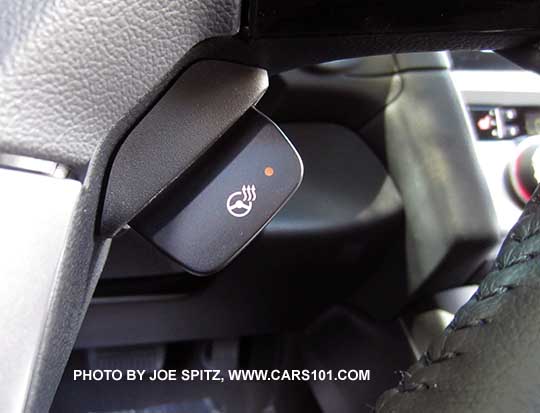 closeup of the 2017 Outback Touring heated steering wheel on/off button