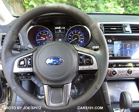 2017 Outback Touring gray leather wrapped, heated steering wheel has gloss black and silver fingertip controls.