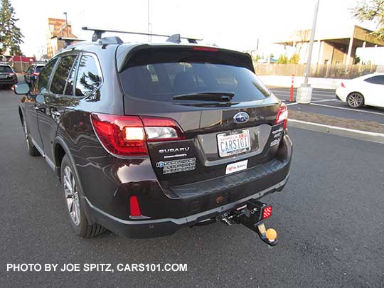 my 2017 Outback Touring, brilliant brown, with aftermarket 2" trailer hitch with Harbor Freight dual 2" receiver and lower hitch ball (tennis ball) and aftermarket brake light for added safety. No one will want to bump into the back of this car.