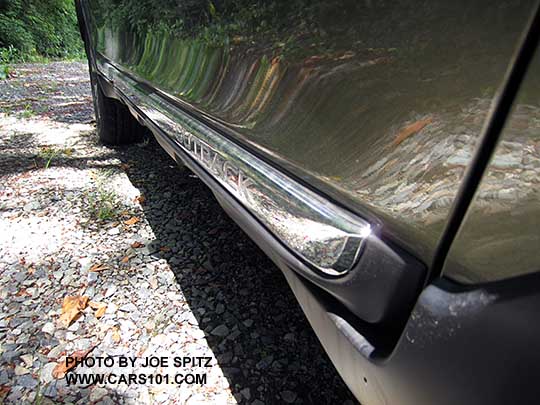 2017 Subaru Outback Touring chrome lower rocker panel strip and Outback logo. Wilderness green shown.