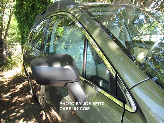 2017 Subaru Outback 2.5i base model black unpainted outside mirrors and chrome window trim. Wilderness green shown.
