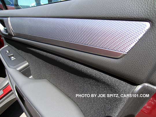 closeup of the 2017 Subaru Outback 2.5i and Premium textured silver dash and door trim. Front passenger door shown.