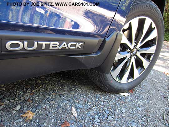 2017 Subaru Outback black rocker panel trim with Outback logo. Limited model, lapis blue color shown.