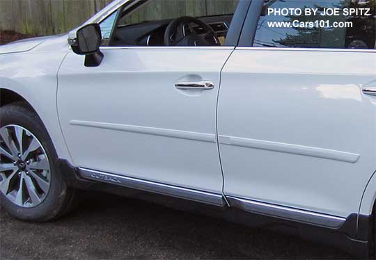 white 2017 Subaru Outback Touring with body colored bodyside moldings. white car car shown.