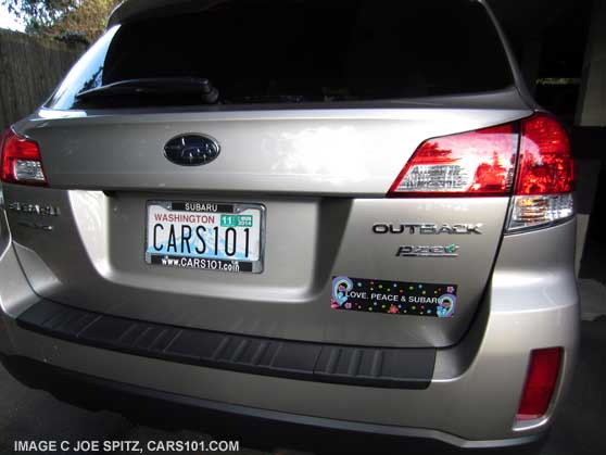 car with Subaru's 'Love, Peace, & Subaru' magnetic bumper sticker from the 2014 Seattle flower and garden show