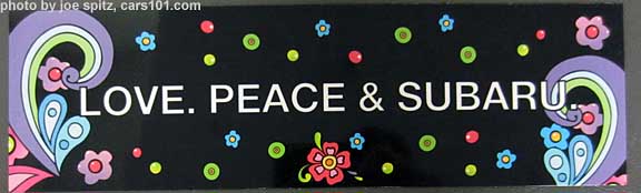 close up of Subaru's "Love, Peace & Subaru" magnetic bumper sicker, 2014 NW Flower Show