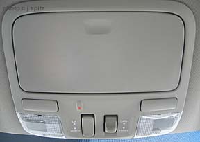 overhead console with sunglass holder, sunroof control, red light for night mapo reading (by passenger)