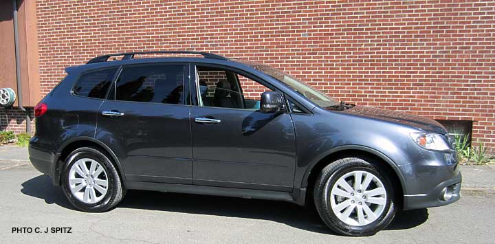 side view, dark grahite gray subaru tribeca