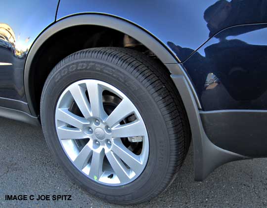 014 subaru tribeca has a 18" alloy wheel, shown with optional splash guard