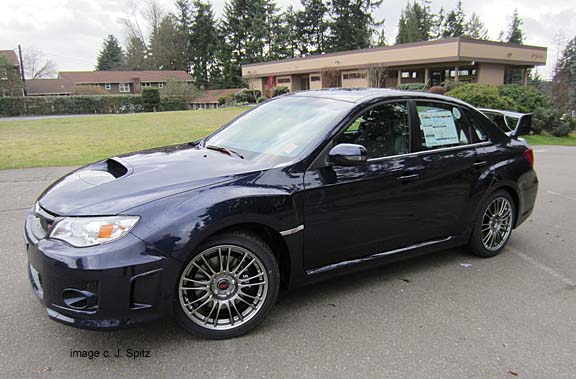 3/4 view of sti sedan, blue