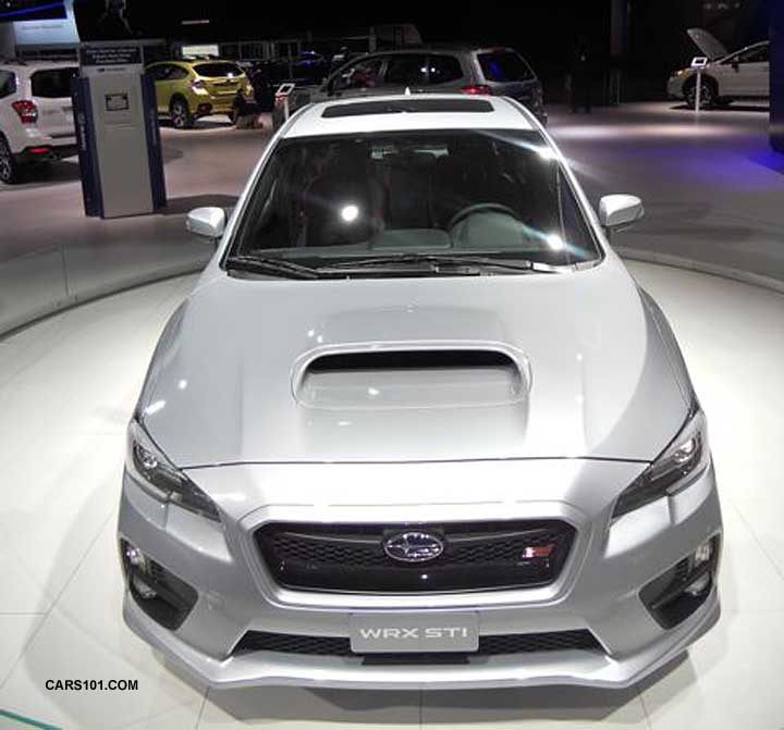front of the silver Limited at the redesigned 2015 STI's debut, January 2014