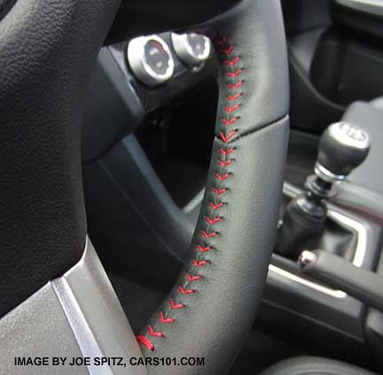 close-up of 2015 wrx leather steering wheel showing red stitching