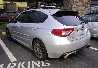 2011 WRX  5door with aftermarket exhaust and red covered tail lights