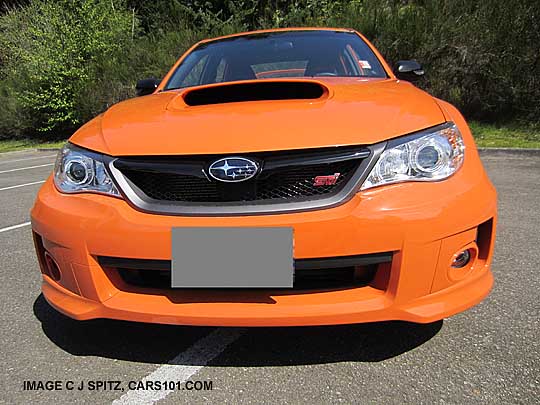 STI 2013 SE Special Edition tangerine orange sedan, front grill shown