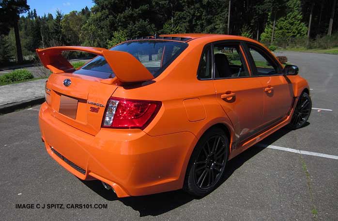 rear view tangerine orange impreza wrx sti se special edition with optional vortex generator