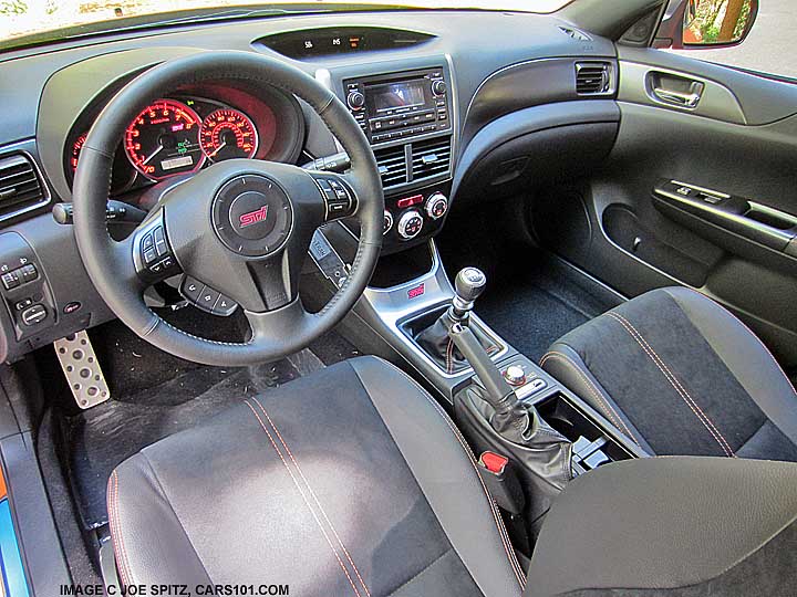 interior of a 2013 subaru impreza wrx sti special edition sti 4 door sedan with orange stitching