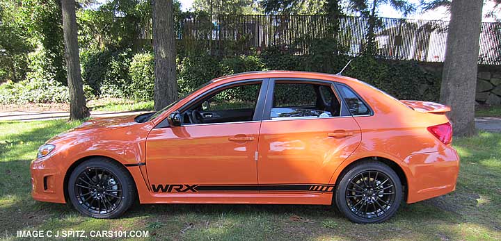 side view subaru impreza wrx tangerine orange sedan