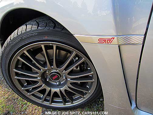 2013 subaru impreza sti logo by front wheels