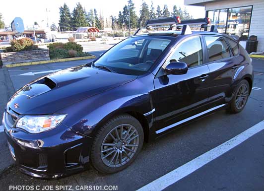 2014 WRX 5 door with Subaru fixed position crossbars and ski attachments