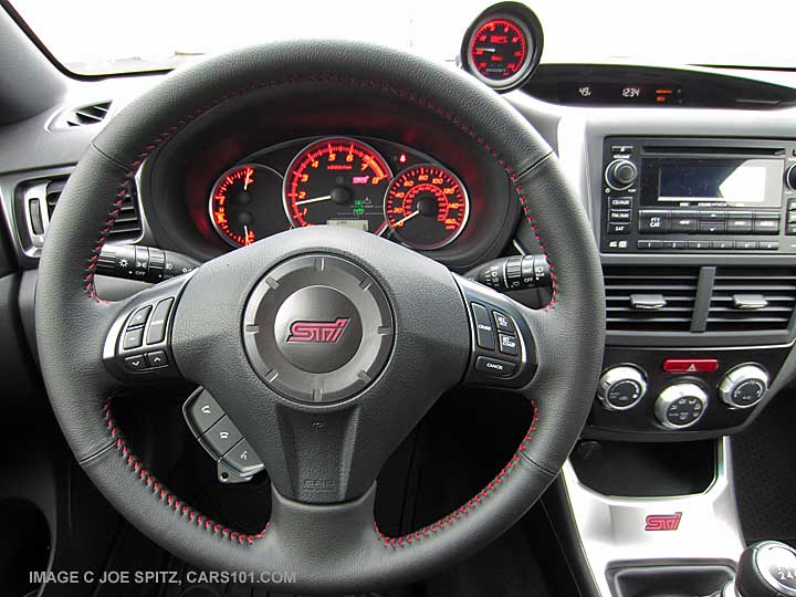 2014 STI steering wheel. Optional turbo boost gauge on dash