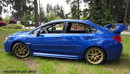 2015 STI Launch Edition- only 1000 made, all WR Blue with gold 18" BBS alloys. shown with optional body side moldings