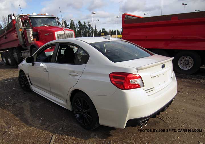 crystal white 2015 wrx premium at a construction site