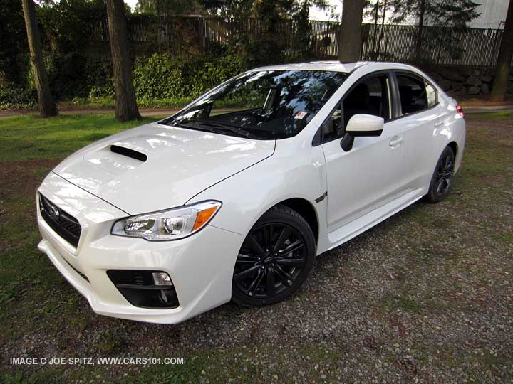 front of a 2015 crystal white wrx