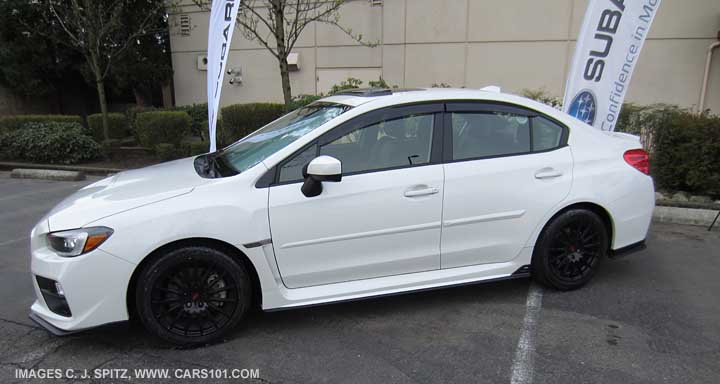 2015 WRX with optional side moldings, 17" black STI alloys, moonroof air deflector, window drip moldings, underspoilers