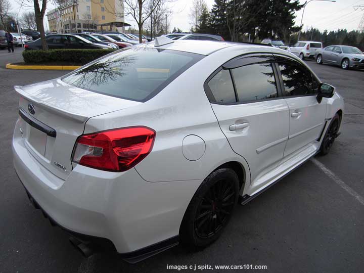 2015 WRX with optional side moldings, 17" black STI alloys, moonroof air deflector, window drip moldings, underspoilers