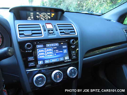 2016 WRX, WRX Premium, WRX Limited, and STI standard 6.2" audio system at the FM radio channel pre-set station screen. WRX shown with single zone climate control. Upper info trip computer screen showing boost gauge