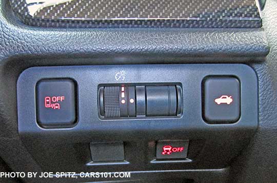 2016 WRX and STI driver controls by driver's left knee, with blind spot and rear cross traffic alert off button, trunk release, VDC off, dash light adjustment