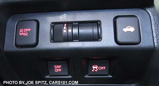 2016 WRX driver controls by dri2016 WRX driver controls by driver's left knee, with (optional) blind spot and rear cross traffic alert off button, dash light adjustment,  trunk release, SRF steering responsive fog lights off (Eyesight cars only), VDC off buttons