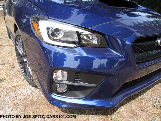 Black inner headlight surround on  2016 WRX Limited,  STI, and STI Limited. Fogt Lights. Lapis Blue STI shown