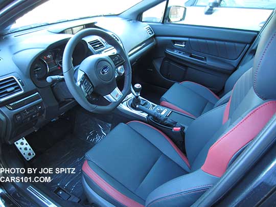 2016 Subaru STI Limited interior, leather front seats, dash, center console with cup holder cover (shown closed)