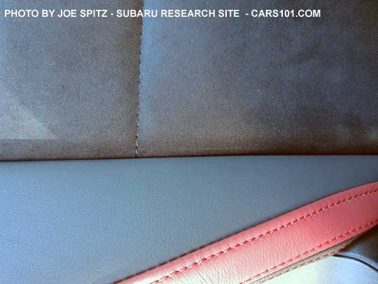closeup of the 2016 STI alcantara and leather seating material with red trim
