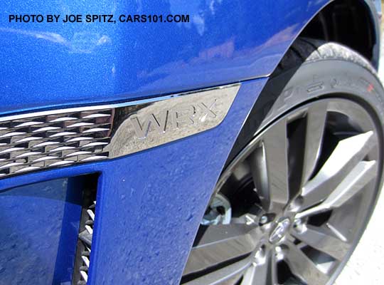 WRX front fender logo and 18" gray split-spoke wheel, WR Blue shown.